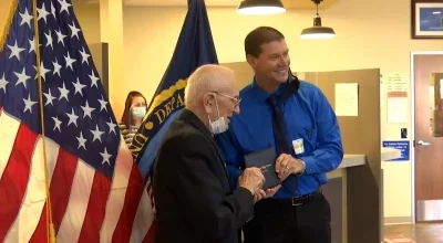 Veteran receives high school diploma after 80 years